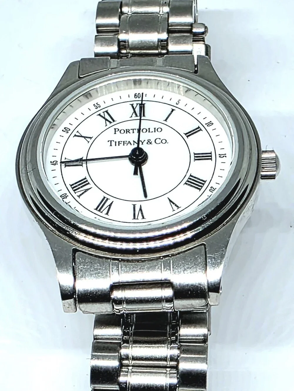 Tiffany & Co. Portfolio Stainless Steel Quartz Watch (Pre-loved) with its origin